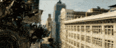 a transformer is flying over a city with a building in the background