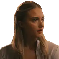 a close up of a woman 's face with a gray shirt on