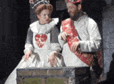 a man and a woman standing next to each other with a sash that says keep calm