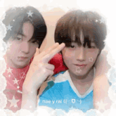 a couple of young men are posing for a picture and making a peace sign .