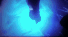 a person is standing in a blue light