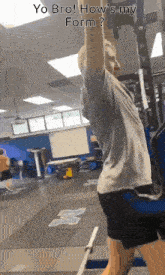 a man is doing a pull up in a gym with the caption yo bro how 's my form
