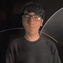 a man wearing glasses and a black shirt that says jace on it