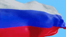 a close up of a russian flag waving in the wind