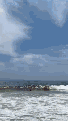 a surfer is riding a wave in the ocean