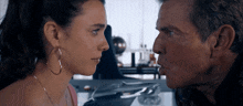 a man and a woman looking at each other