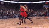 a basketball game is being played in front of a crowd and the score is 22