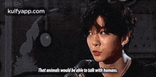 a young man is talking into a microphone and saying `` that animals would be able to talk with humans . ''
