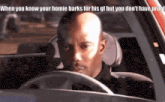 a bald man is driving a car with the caption when you know your homie barks for his gf but you don 't