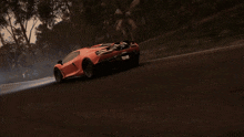 a red car is driving down a road with a gun on the roof