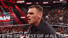 a man standing in front of a crowd with the words i 'm the greatest gif of all time below him