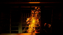 a dark room with a lot of lights coming out of the windows