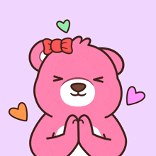a pink teddy bear with hearts around it and a bow on its head