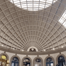 a building with a dome ceiling and a sign that says ' swiss chocolate ' on it