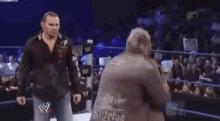 a wrestling ring with a blue rope that says wwe