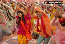 a man and a woman are dancing in front of a crowd with the caption mightymate 118