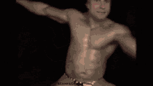 a man without a shirt is dancing in a video that says scamface youtube on the bottom