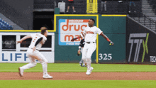 a baseball player in a white uniform with the word indians on the front