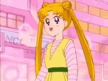 sailor moon is wearing a yellow vest and a pink striped shirt .