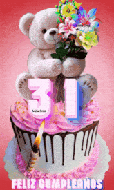 a teddy bear holding a bouquet of flowers on top of a birthday cake with the number 31 on it