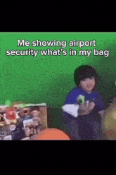 a child is sitting in front of a green wall with the words " me showing airport security what 's in my bag "