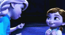 elsa and anna from frozen are standing next to each other .