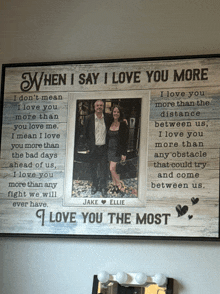 a framed picture of a man and woman with the words " when i say i love you more " on it
