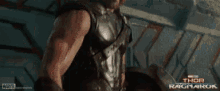 a close up of thor ragnarok with a marvel logo on the bottom
