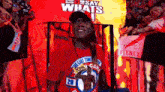 a man wearing a red shirt that says " the last time "