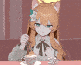 a girl with a flower in her hair sits at a table with a cup of cappuccino
