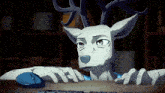 a cartoon deer is sitting at a desk with a keyboard and mouse
