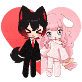 a boy and a girl are standing next to each other in front of a red heart
