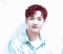 a man with red hair is wearing a blue shirt with the word cherry on the bottom