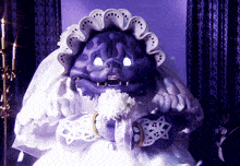 a purple monster dressed as a bride is holding a bouquet of white flowers