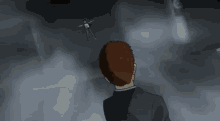 a man in a suit stands in front of a man flying through the air