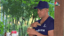 a man wearing a blue shirt with the number 6 on it