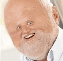 an elderly man with a beard is smiling with his mouth wide open