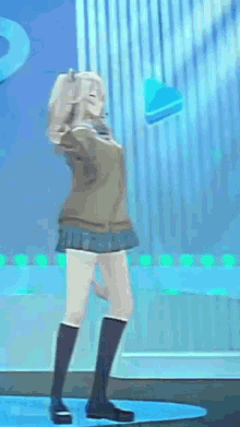a girl in a skirt and knee high socks is dancing on a stage in a video game .