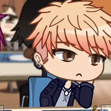 a cartoon character with red hair is sitting at a table with his hand on his chin