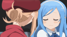 a girl with blue hair is being kissed by another girl