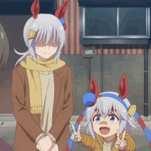 a man and a girl are standing next to each other and the girl is wearing a headband with horns