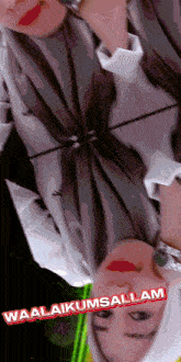 a woman 's face is reflected in a mirror and the words waalaikumsalam are visible