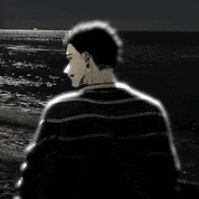 a black and white drawing of a man standing on the beach looking at the ocean .