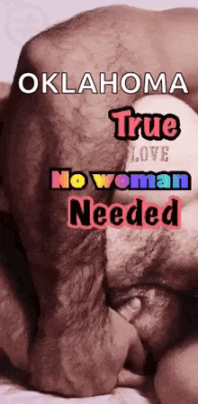 a man is laying on a bed with the words oklahoma true love no woman needed