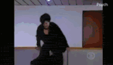 a woman in a black dress is dancing in a room with the words psych on the bottom