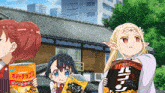 a girl holding a bag of calben potato chips stands next to two other girls