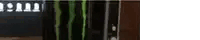a close up of a monster energy drink in a glass bottle .