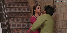 a man and a woman are standing next to each other with the words pranay_varma on the bottom left