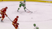 a hockey player with the number 43 on his back is skating on the ice