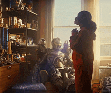 a person standing next to a robot with the word kepler on the bottom